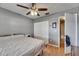 Bedroom with light wood floors, closet, and door leading to other rooms at 15820 Sapwood St, Tampa, FL 33624