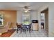 Sunny dining area with backyard views, seamlessly flowing to the living area and kitchen at 15820 Sapwood St, Tampa, FL 33624
