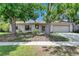 Charming single-story home with a well-maintained lawn and mature trees, offering great curb appeal at 15820 Sapwood St, Tampa, FL 33624