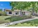 Pleasant single-Gathering home with a well-maintained lawn and driveway, showcasing classic suburban charm at 15820 Sapwood St, Tampa, FL 33624