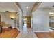 Bright and inviting foyer with tile flooring, leading to spacious living areas with hardwood and natural light at 15820 Sapwood St, Tampa, FL 33624