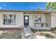 The front porch has brick accents, a cozy bench and a well-maintained walkway leading to the main entrance at 15820 Sapwood St, Tampa, FL 33624