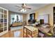 Bright office featuring natural light from the window, complemented by hardwood flooring and stylish furnishings at 15820 Sapwood St, Tampa, FL 33624