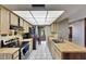 Classic kitchen with wood cabinets, tile floors, and stainless-steel refrigerator, offering a functional and stylish space at 15820 Sapwood St, Tampa, FL 33624
