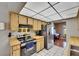 Charming kitchen with light wood cabinetry and updated appliances offering a bright and inviting cooking space at 15820 Sapwood St, Tampa, FL 33624