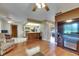 Inviting living room seamlessly connects to the kitchen, creating an open and airy space for modern living at 15820 Sapwood St, Tampa, FL 33624