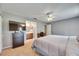 Comfortable main bedroom with an ensuite bath, a ceiling fan, and a spacious closet at 15820 Sapwood St, Tampa, FL 33624