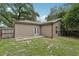 The backyard has partial green grass and a fence surrounding the perimeter at 1605 Prescott S St, St Petersburg, FL 33712