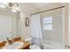 Cozy bathroom featuring a shower-tub combination with neutral wall tiles at 1605 Prescott S St, St Petersburg, FL 33712
