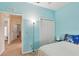 Bedroom with light blue walls, and an entry to the hallway at 1605 Prescott S St, St Petersburg, FL 33712