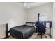 Bedroom featuring black bed set and desk area with a computer at 1605 Prescott S St, St Petersburg, FL 33712