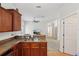 Open kitchen featuring stainless steel sink, breakfast bar, and tile flooring at 1605 Prescott S St, St Petersburg, FL 33712