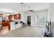 Bright living room features a kitchen breakfast bar, neutral carpet, and natural light at 1605 Prescott S St, St Petersburg, FL 33712