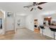 Bright living room with neutral carpet, natural light, and kitchen breakfast bar at 1605 Prescott S St, St Petersburg, FL 33712
