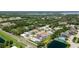 Community aerial view featuring lush greenery, nearby lakes, and well-maintained residential streets at 1716 Bermuda Ct, Safety Harbor, FL 34695