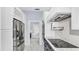 Modern kitchen with stainless steel appliances, white cabinets with stainless steel hardware, and granite countertops at 1716 Bermuda Ct, Safety Harbor, FL 34695