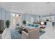 Elegantly staged living room with stylish furniture and plenty of natural light at 1716 Bermuda Ct, Safety Harbor, FL 34695