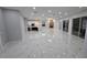 Expansive living space with tile floors, kitchen, fireplace, and outdoor views at 1716 Bermuda Ct, Safety Harbor, FL 34695