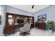 Home office setup with a desk, shelving, and comfortable chair, ideal for working at 1716 Bermuda Ct, Safety Harbor, FL 34695