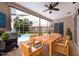 Covered patio featuring a dining table, a barbecue grill, and a view of the pool at 1716 Bermuda Ct, Safety Harbor, FL 34695
