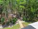Aerial view of backyard stone path with mature trees and landscaping at 17906 Loretta Ln, Lutz, FL 33548