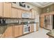 Charming kitchen featuring granite counters, tiled backsplash, and modern stainless steel appliances at 17906 Loretta Ln, Lutz, FL 33548