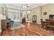 Spacious living room featuring hardwood floors, a dining table, and access to the outside at 17906 Loretta Ln, Lutz, FL 33548