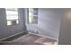Comfortable bedroom with carpet, two windows with view and cozy atmosphere at 1908 S Kingsway Rd, Seffner, FL 33584