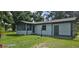 Charming single-story home with a screened porch, neutral paint, and well-maintained lawn at 1908 S Kingsway Rd, Seffner, FL 33584