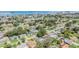 Sprawling community aerial showcases peaceful residential area near the water, lush landscaping and manicured lawns at 2025 Jefferson Ave, Dunedin, FL 34698