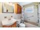 Cozy bathroom with vanity, toilet, and shower-tub combo at 2025 Jefferson Ave, Dunedin, FL 34698