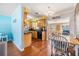 Well-lit kitchen with wooden cabinetry, black appliances, and an open view to the dining area at 2025 Jefferson Ave, Dunedin, FL 34698
