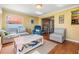 Inviting living room featuring comfortable seating and ample natural light at 2025 Jefferson Ave, Dunedin, FL 34698