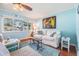 Bright and airy living room with comfortable seating, hardwood floors, and natural lighting at 2025 Jefferson Ave, Dunedin, FL 34698