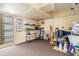 Large storage area with overhead lighting, storage shelves and carpeted flooring at 2025 Jefferson Ave, Dunedin, FL 34698