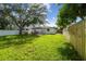 Expansive backyard with verdant grass, ideal for outdoor activities and relaxation at 206 N Beverly Ave # 1/2, Tampa, FL 33609