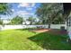Lush backyard with a white fence, perfect for outdoor gatherings at 206 N Beverly Ave # 1/2, Tampa, FL 33609