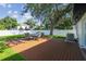Backyard featuring a spacious deck with a table and chairs for outdoor entertainment at 206 N Beverly Ave # 1/2, Tampa, FL 33609