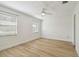 Bright bedroom with wood-look floors and ceiling fan at 206 N Beverly Ave # 1/2, Tampa, FL 33609