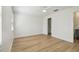 Bright bedroom featuring hardwood floors and white trim at 206 N Beverly Ave # 1/2, Tampa, FL 33609