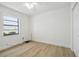 Bright bedroom features wood floors, a window and closet access at 206 N Beverly Ave # 1/2, Tampa, FL 33609