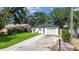 Charming single-story home with a well-manicured lawn and inviting curb appeal with an attached single-car garage at 206 N Beverly Ave # 1/2, Tampa, FL 33609