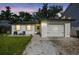 Charming home featuring a well-manicured lawn, textured exterior, and cozy front patio seating at 206 N Beverly Ave # 1/2, Tampa, FL 33609