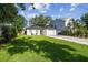 Cozy home featuring a well-manicured lawn and charming front patio seating at 206 N Beverly Ave # 1/2, Tampa, FL 33609