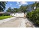 Cozy home featuring a well-manicured lawn and charming front patio seating at 206 N Beverly Ave # 1/2, Tampa, FL 33609