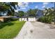 Cozy home featuring a well-manicured lawn and charming front patio seating at 206 N Beverly Ave # 1/2, Tampa, FL 33609