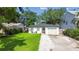 Inviting single-story home with a well-kept lawn and a stone driveway at 206 N Beverly Ave # 1/2, Tampa, FL 33609