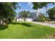 Inviting single-story home with a lush green lawn and a driveway at 206 N Beverly Ave # 1/2, Tampa, FL 33609