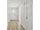Hallway showcasing wood-look tile and white doors at 206 N Beverly Ave # 1/2, Tampa, FL 33609