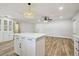 Bright kitchen featuring an island, wooden tile floors, stainless steel appliances, and ample space at 206 N Beverly Ave # 1/2, Tampa, FL 33609